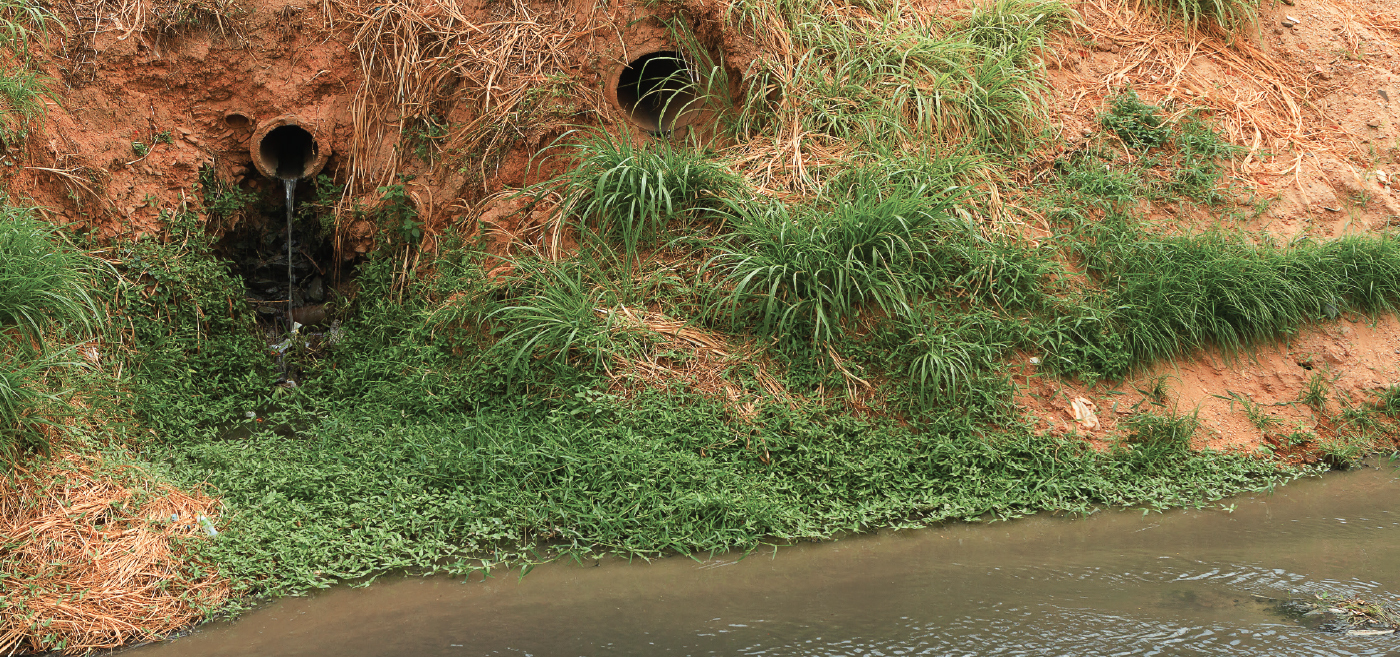 Pipes emptying in a body of water.