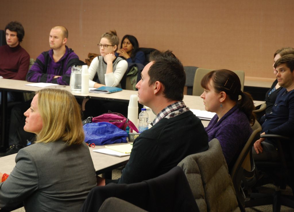 Participants on a seminar intently listening