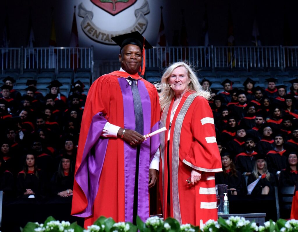 Honorary degree recipient Mark Beckles (left) with President and Vice-Chancellor Rhonda Lenton (right).