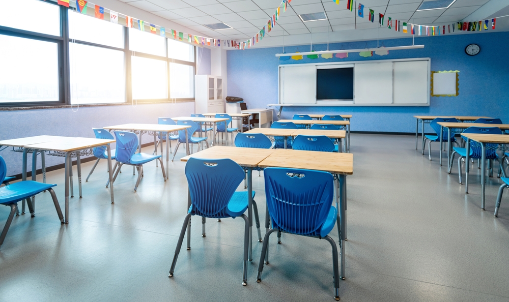 empty classroom with desks and chairs