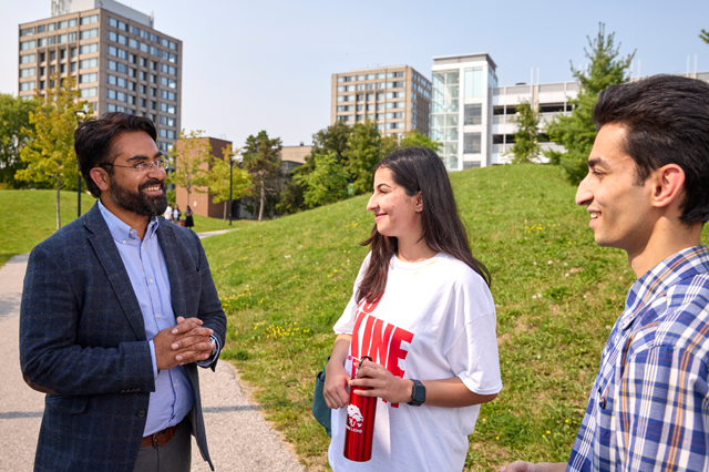 Photo of students having conversations on campus