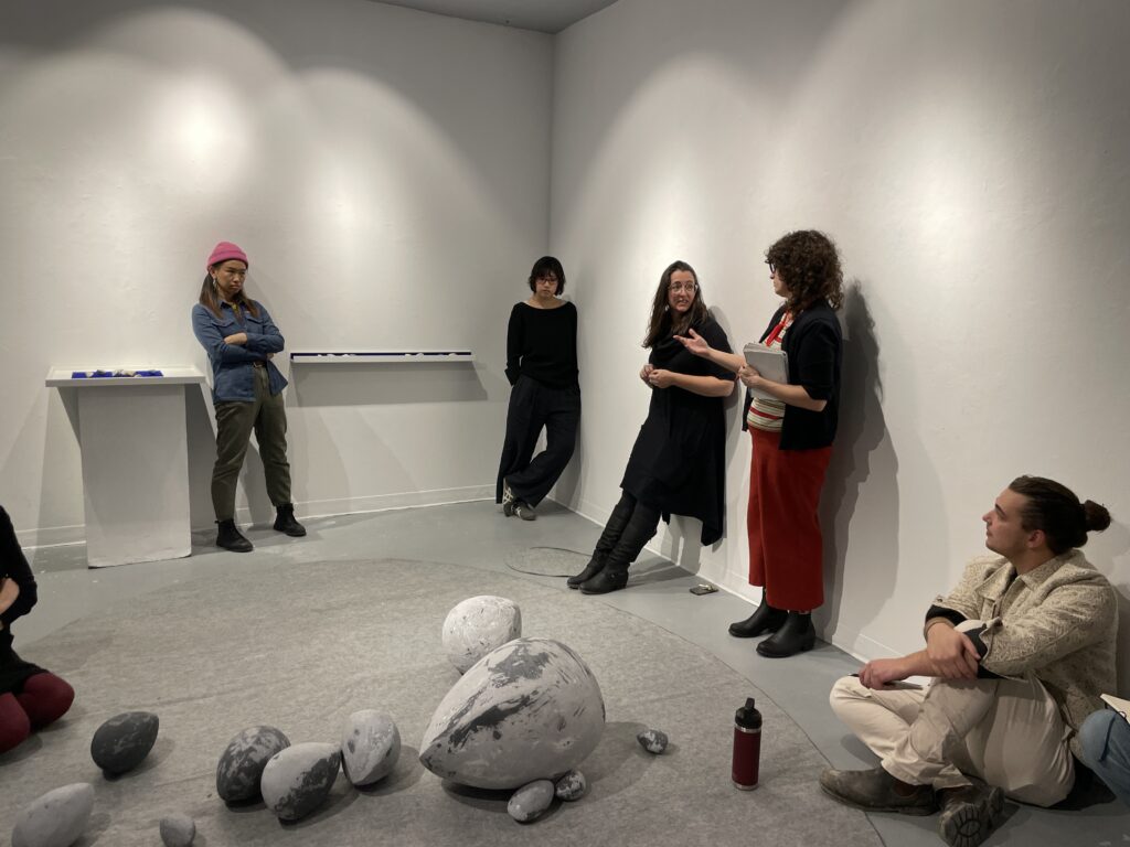 Photo of students engaged in discussion during a workshop/exhibition