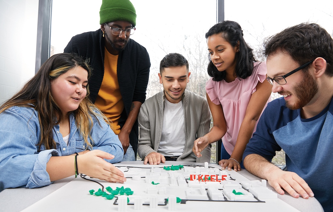 a photo of students working together on a project