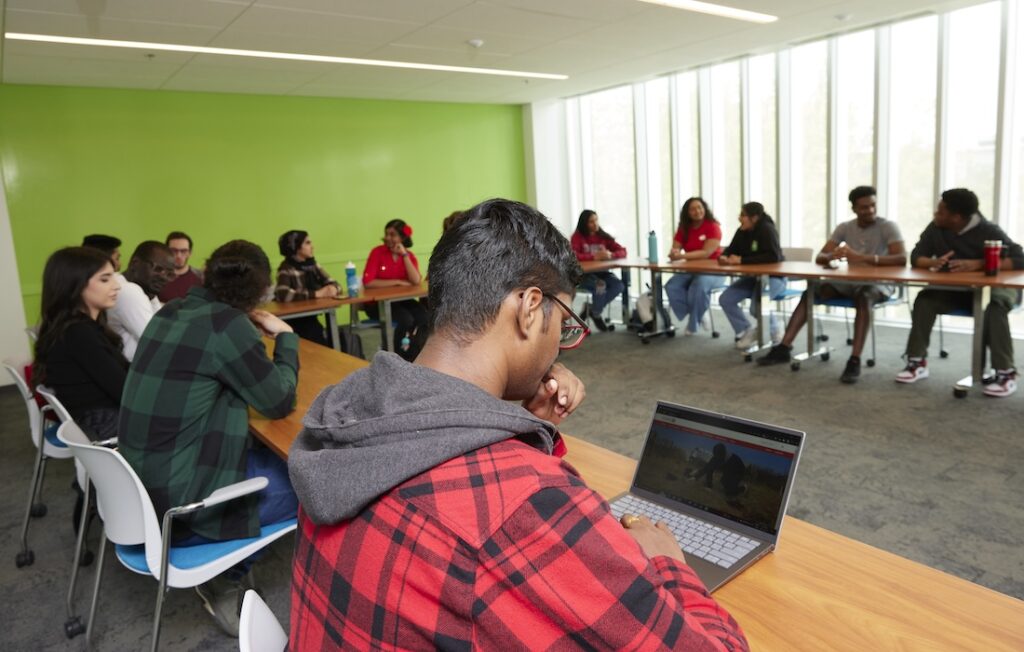 a photo of students participating in a seminar on campus