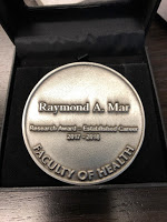 Picture of Award engraved with: Raymond A. Mar, Research Award - Established Career, 2017 - 2018, Faculty of Health