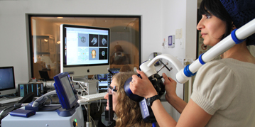 Students performing a brain scan in a psychology lab