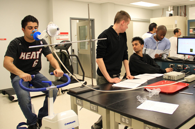 Kinesiology students conducting research in a lab.