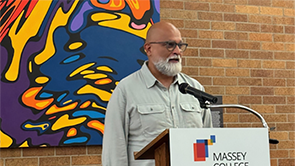 Professor Hirji speaking at Massey College