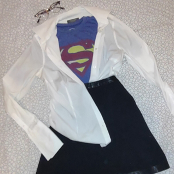 supergirl costume on a bed
