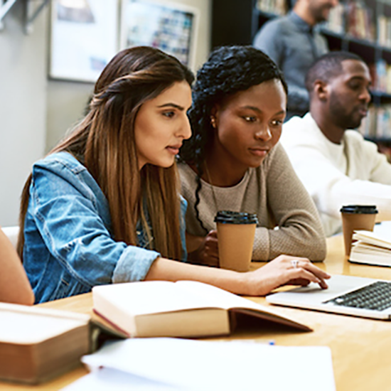 two female worried students in a study room