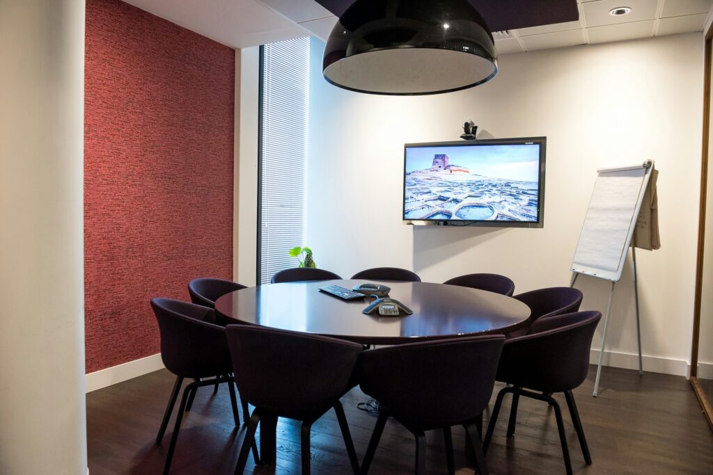 A photo of a circular table surrounded by chairs. Photo: Arlington Research