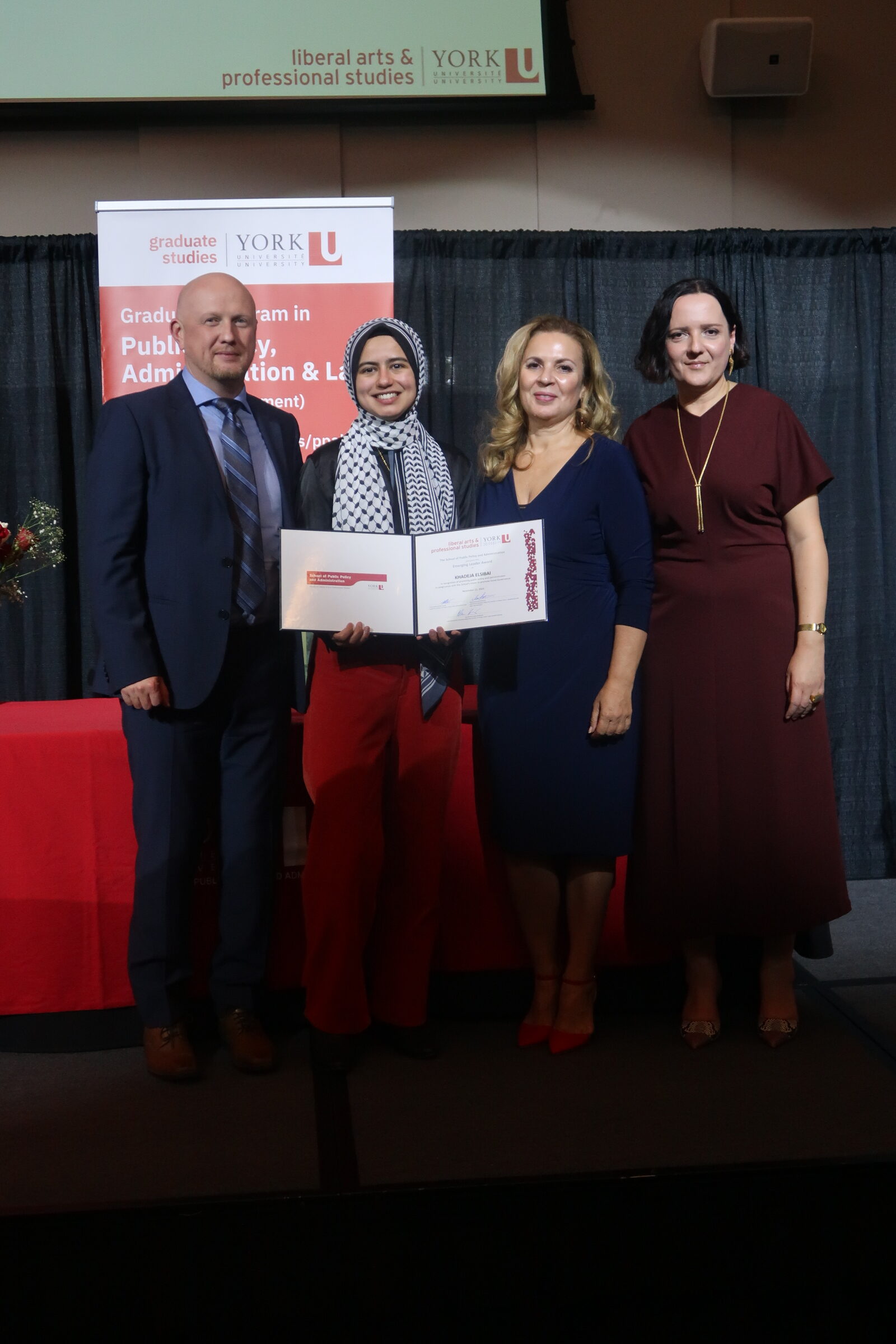 Photo of student receiving an award on stage.