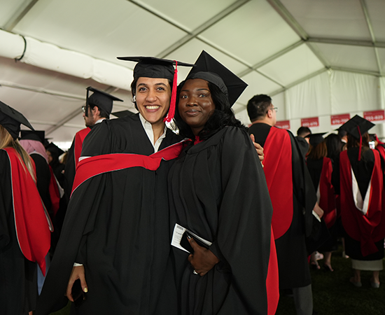 two students at a graduation