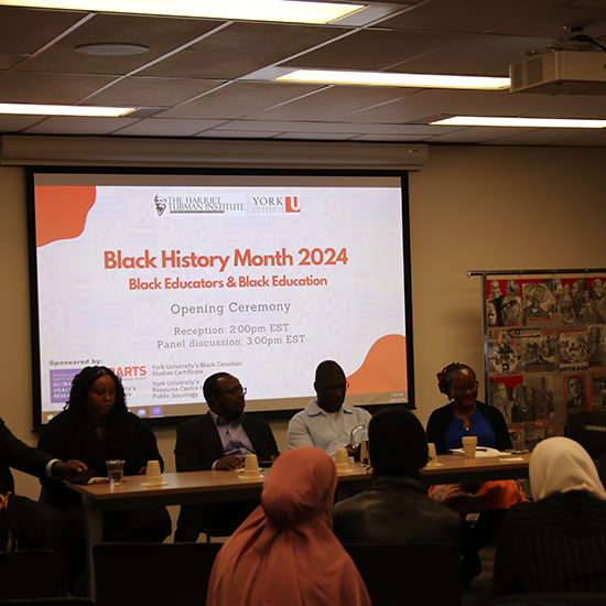 Panelists sitting at the front of the room, for the opening ceremony for Black History Month 2024.