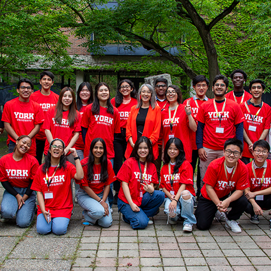 Pre-orientation cohort posing together with staff and faculty in LA&PS t-shirts.