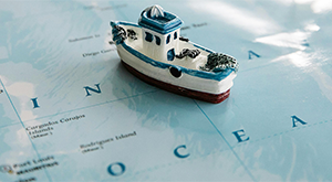 Toy boat on a map of the Indian Ocean