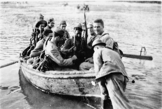 Black and white photo of soldiers on a boat