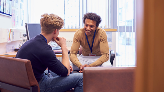 Male Student Meeting with advisor