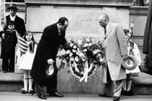 two Hellenic men greeting each other