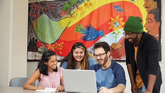 students studying in front of laptop