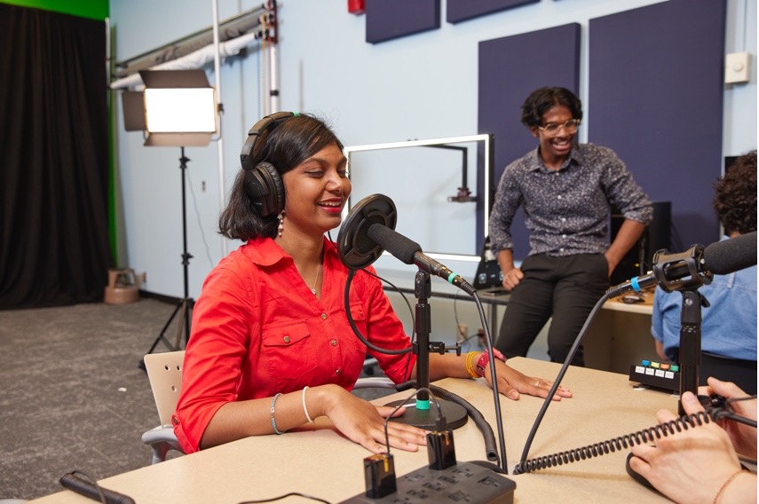 Two students recording a podcast