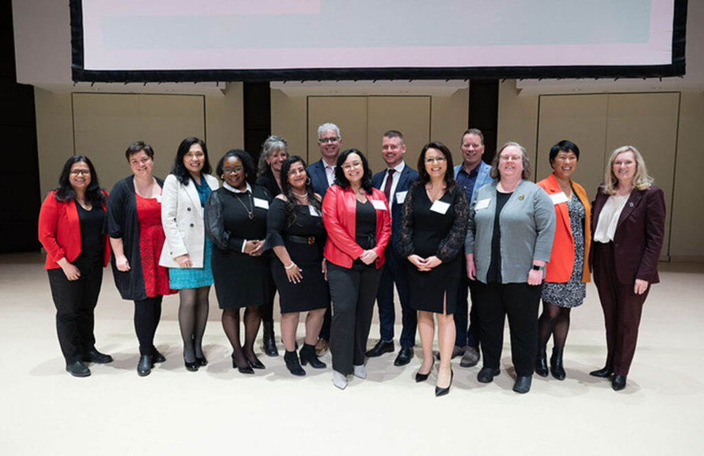 President Rhonda Lenton with a group of faculty members and partners.