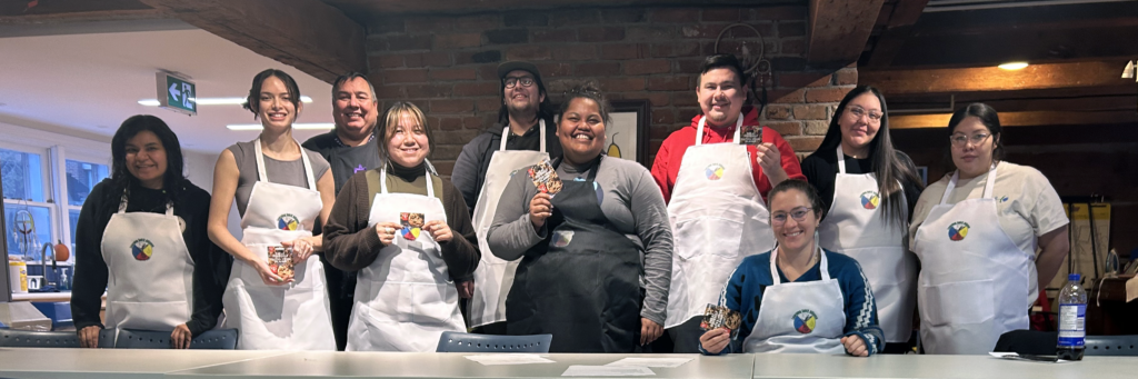 A group of students in chef's aprons.