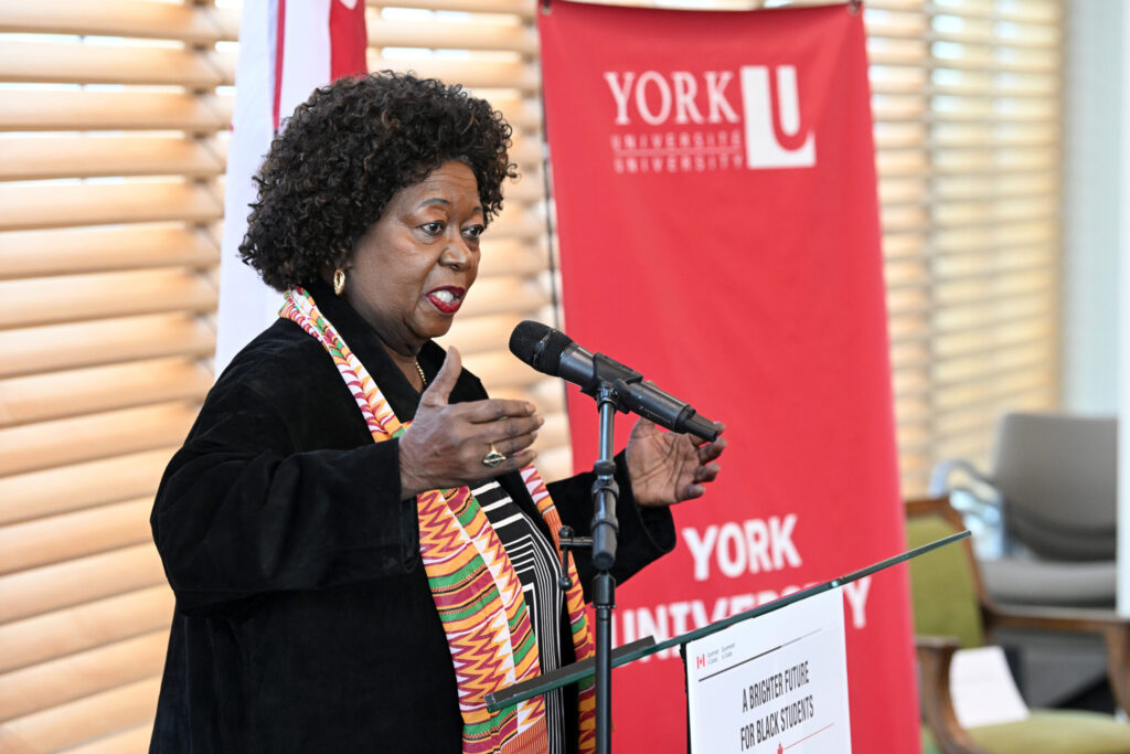 Jean Augustine Chair speaking at a podium.