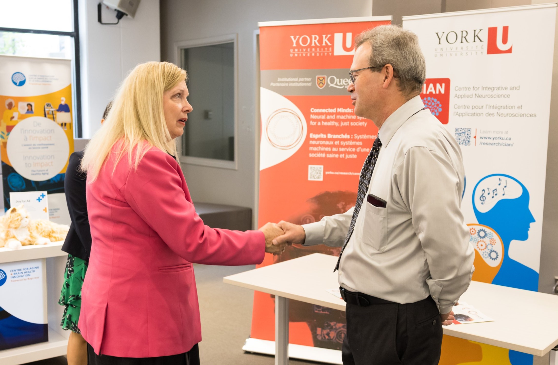 Doug Crawford shakes hands with MP Valerie Bradford