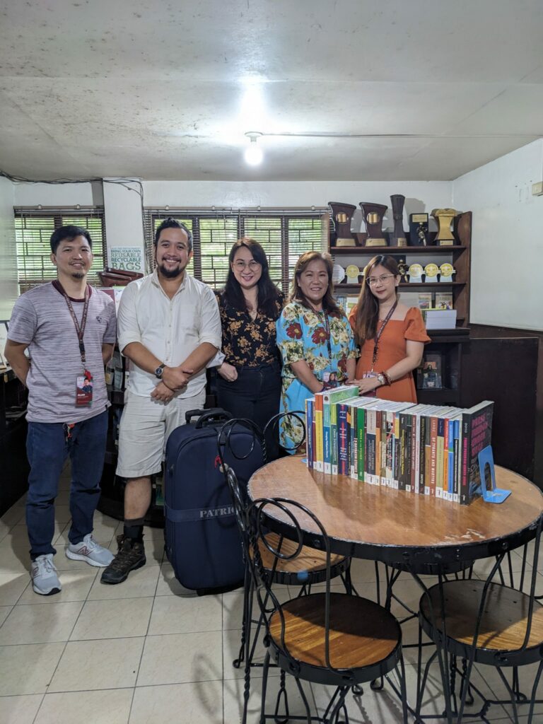 Kenneth Cardenas (second from left) in the Philippines where he is collecting materials for the Filipiniana collection.