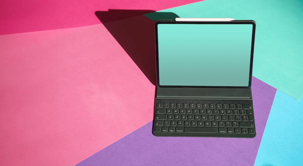 Laptop with blank screen mockup. Colorful background. Graphic tabblet.