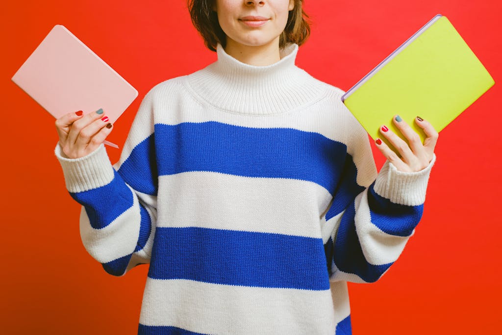 Woman Holding Notebooks