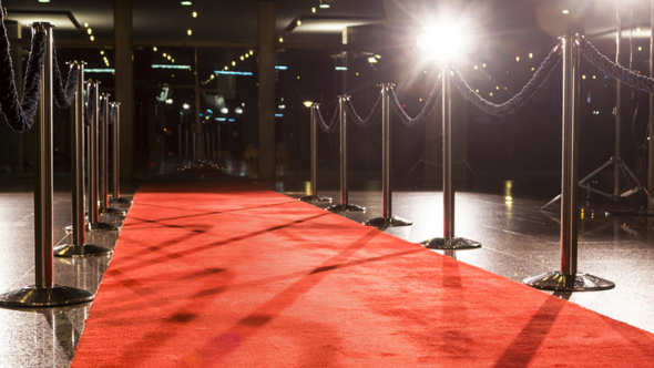 A red carpet with a bright light shining directly on it.