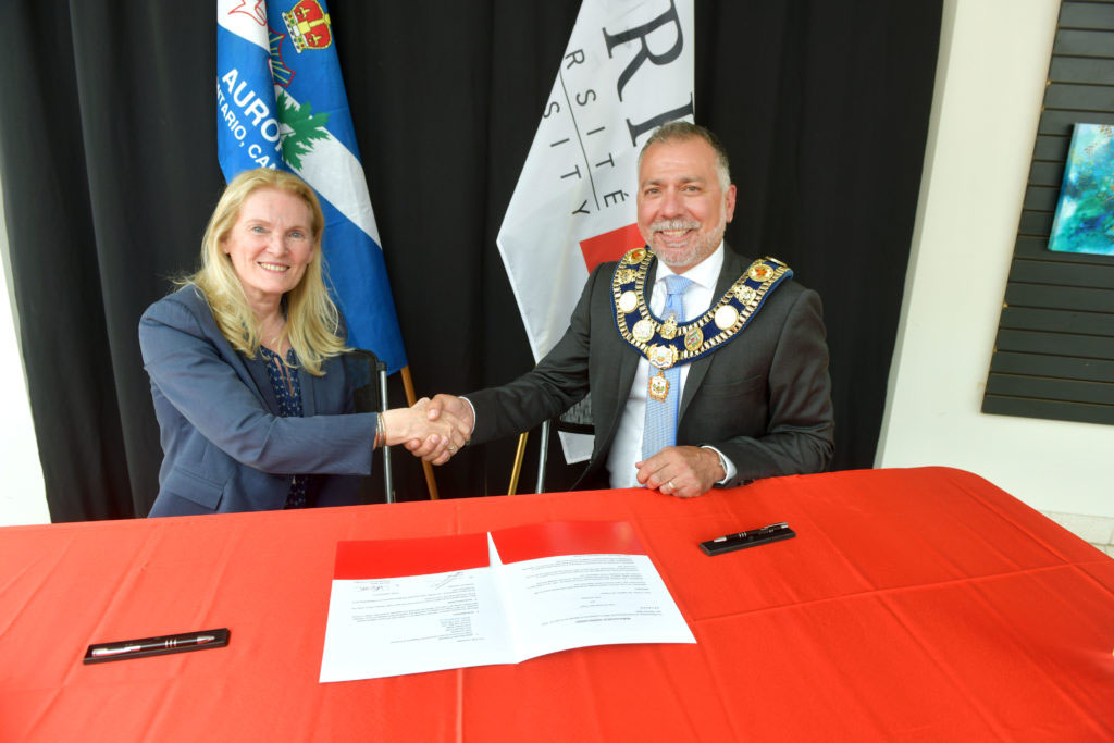 Rhonda Lenton and Town of Aurora Mayor Tom Mrakas at MOU signing on June 20 story image