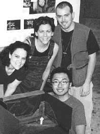 Jennifer Jimenez, Bridget Steis, Ted Rouse and Ken Chan stand with the exhibit sent to Prague Quadrennial '99.