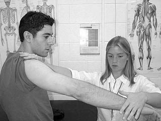 Second-year student therapist Susan Rabjohn assesses a student-athlete at the Tait Sport Injury Clinic.