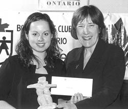 York President Lorna Marsden receives Inukshuk as student Diane Dias receives scholarship