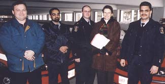 Clark in 2000,  with staff members