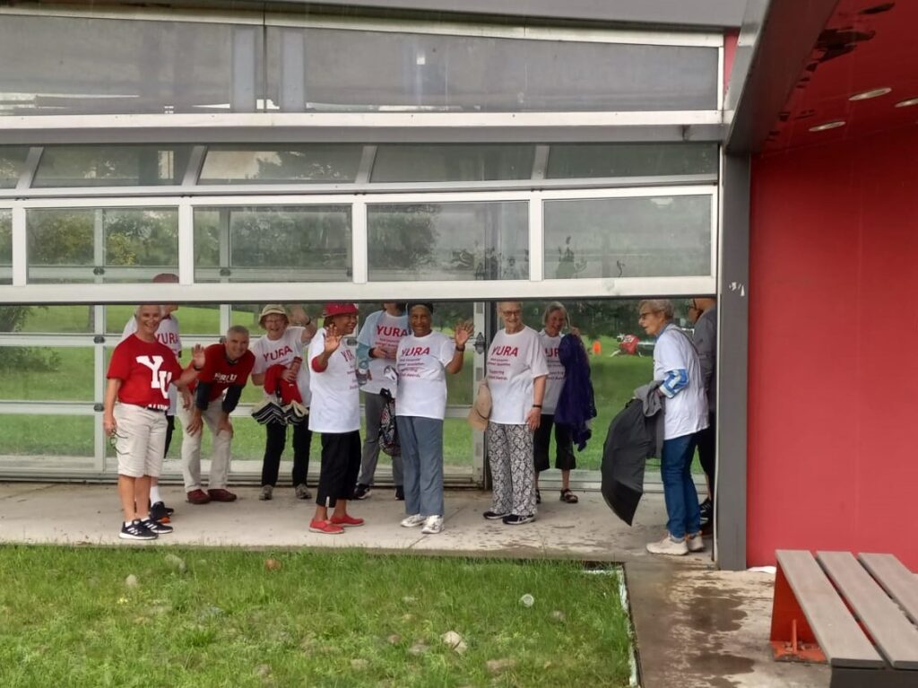 All participants on the YURA walk have taken shelter in the structure west of Calumet College, waiting for the downpour of rain to dissipate