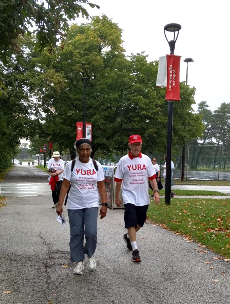 Amina Hussain and Steve Dranitsaris walking near Founders College